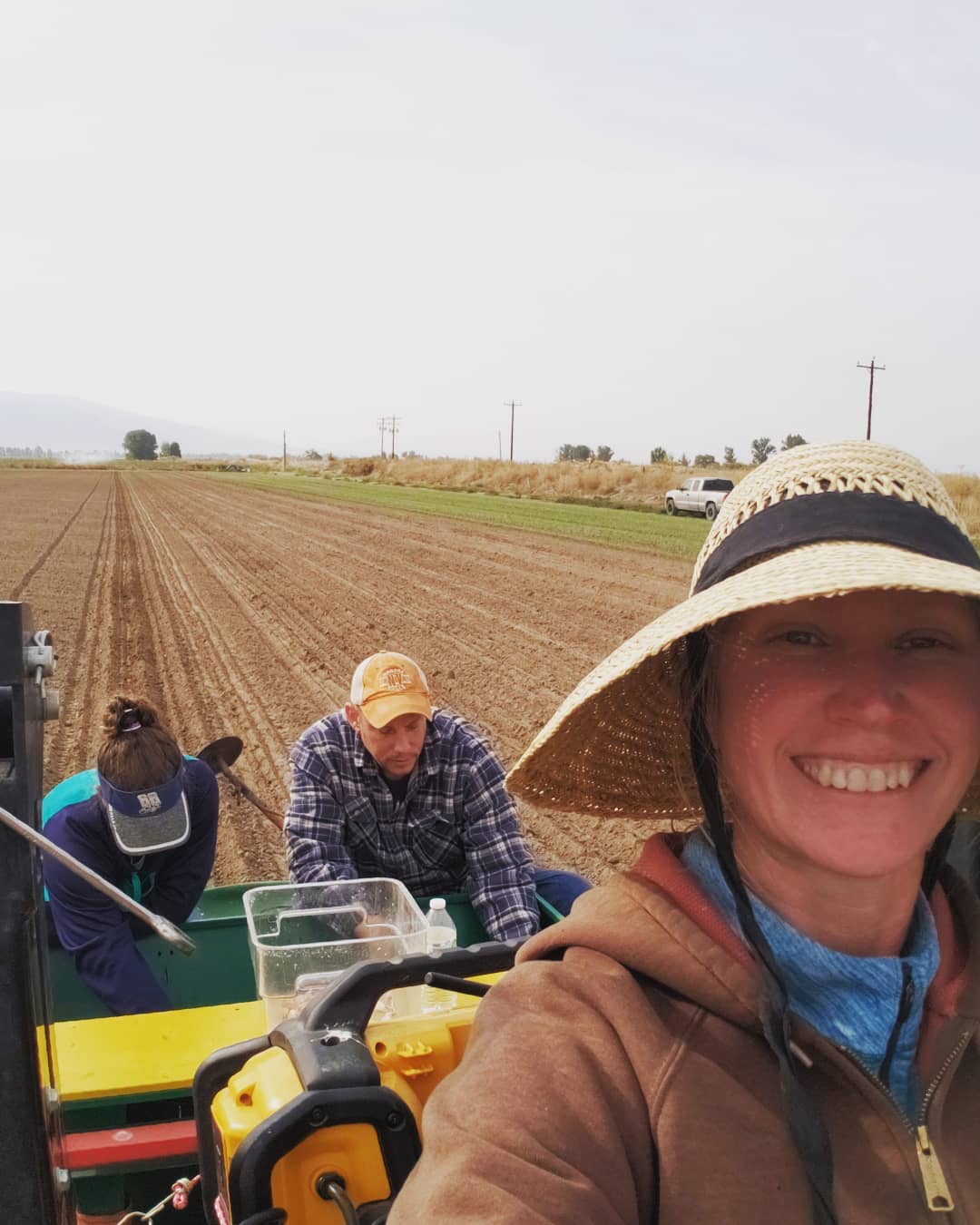 Jana and Geoff planting garlic in October